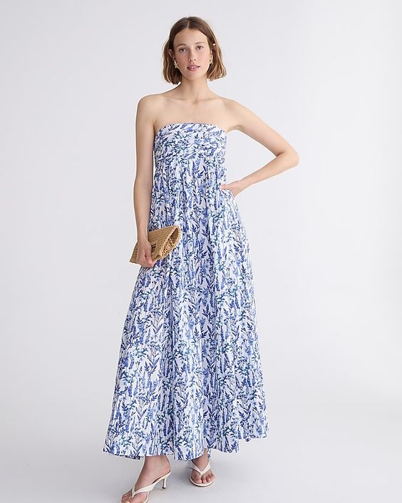 woman wearing a blue and white strapless dress. 