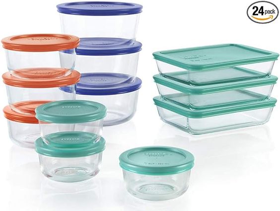 Pyrex glass storage containers with green, blue and red lids. 