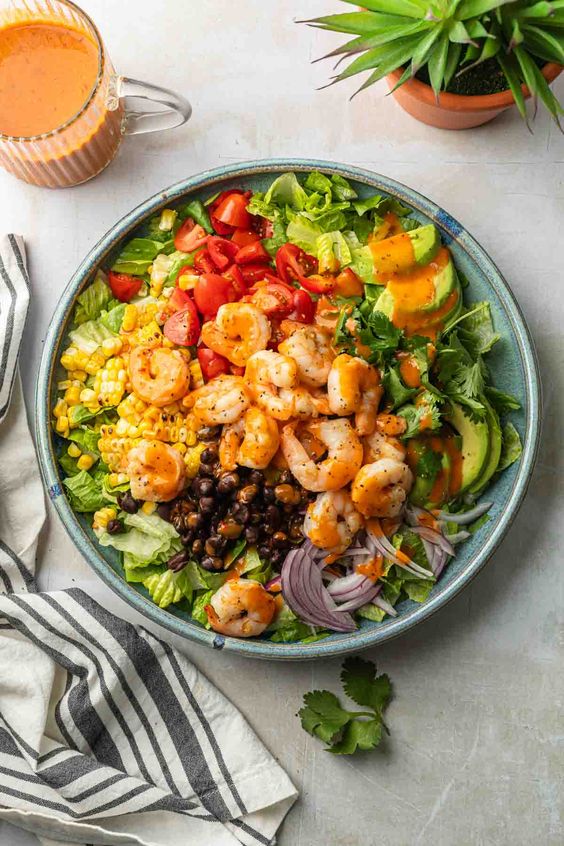 spicy shrimp salad in a blue bowl. 