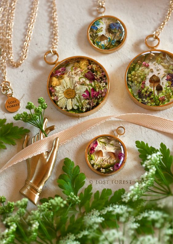A collection of necklaces with dried flowers. 