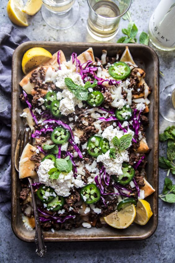 Sheet pan of beef pita nachos. 