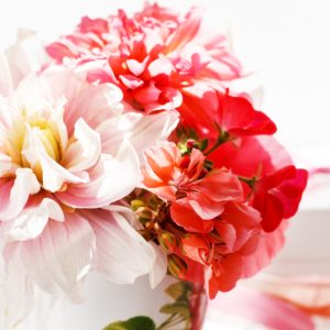 pink and red dahlias in a vase.