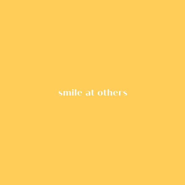 Smile at Others Quote on a yellow background. 