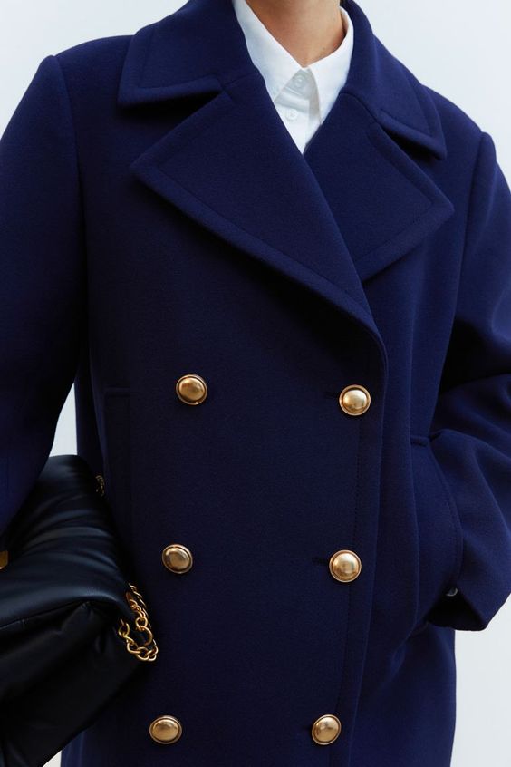 blue pea coat with gold buttons. 