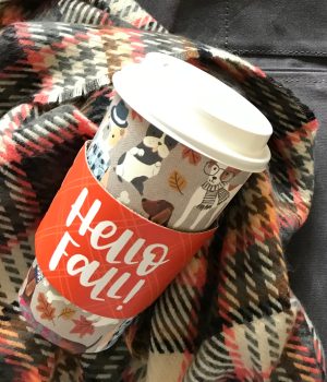 Hello Fall cup with dogs on it and plaid scarf.
