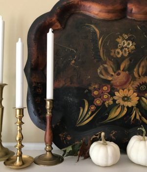 Weekend meanderings, a toll tray with flowers, 3 wood candle holders with white candles and 2 white mini-pumpkins.