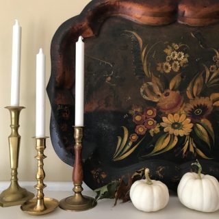 Weekend meanderings, a toll tray with flowers, 3 wood candle holders with white candles and 2 white mini-pumpkins.