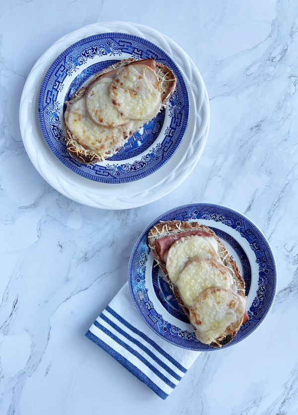 ham, gruyere, pickled apple tartine on blue and white transfere-ware plates