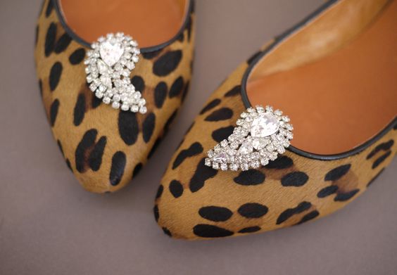 Rhinestone brooches on shoes. 