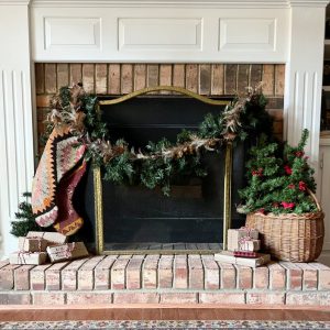 fireplace with stockings and garland
