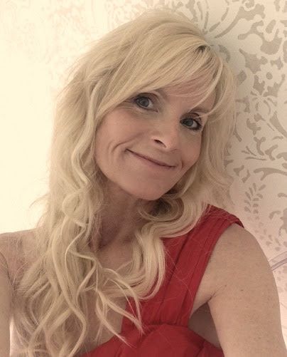 Woman wearing a red dress with blond hair