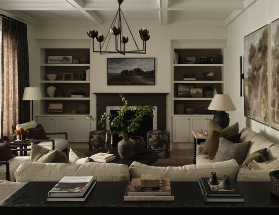 Tiffany Leigh Design moody living room with bookcases, comfy couches.
