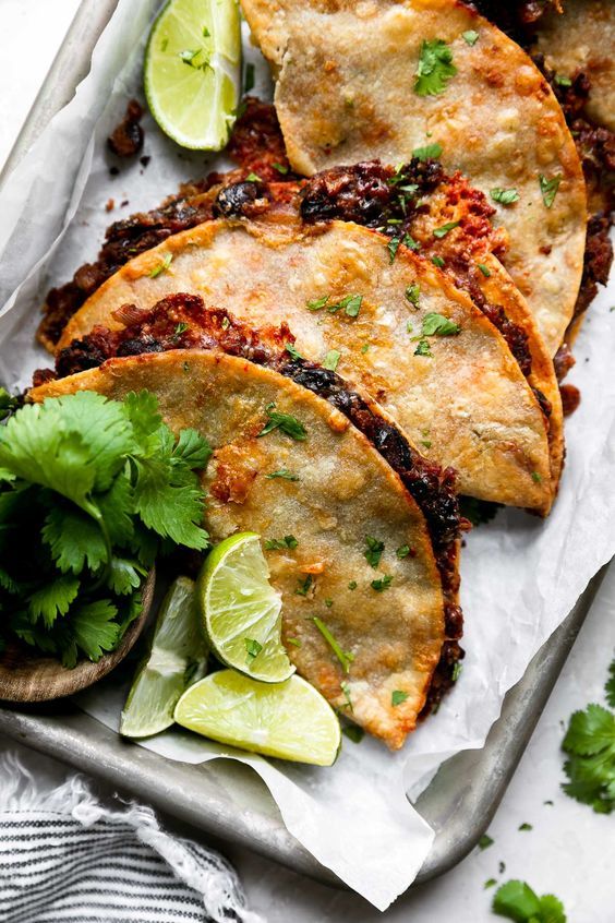 Crispy Black Bean Tacos with limes on the side. 