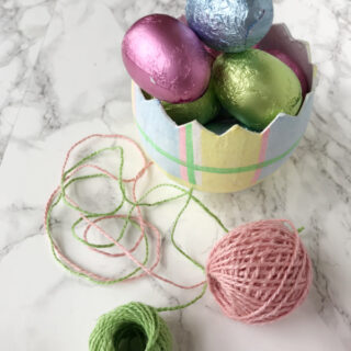 Chocolate Foil Easter eggs in a paper cache egg with pink and green twine.