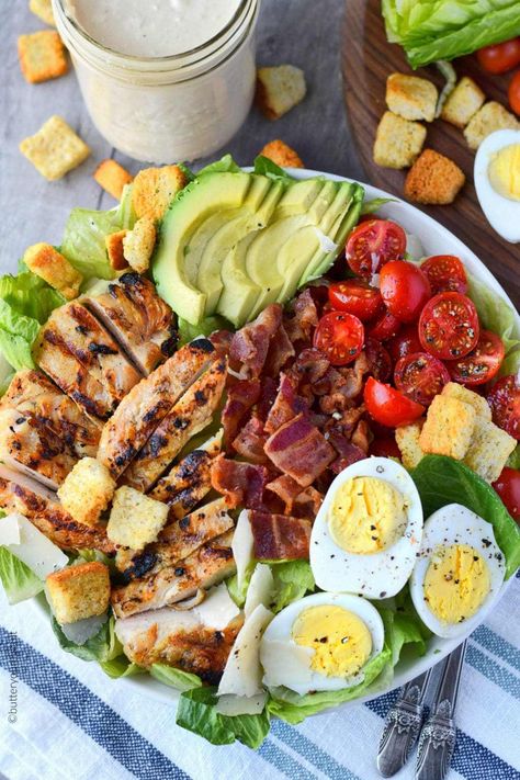 Grilled Chicken avocado salad with bacon, eggs, tomatoes.