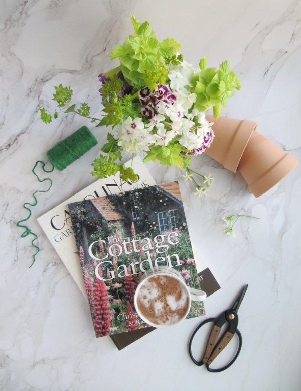 terracotta pots garden books and scissors.