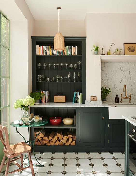 Green Kitchen cabinets with white walls. 