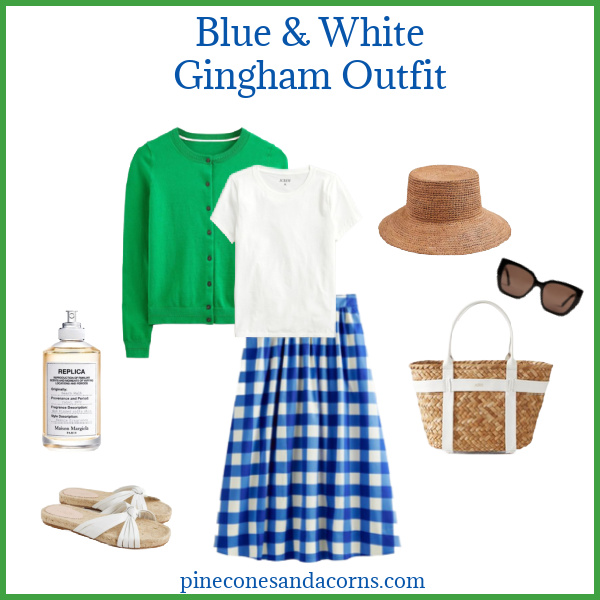 Gingham outfit Fashion over 50 blue and white skirt, green sweater, white shirt, sandals and bag with a straw hat and perfume. 