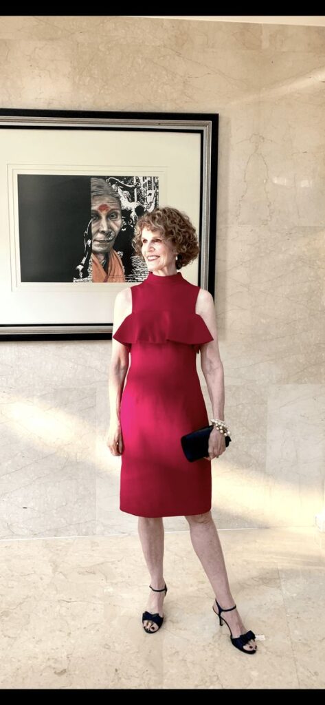 Woman wearing a burgundy dress. 