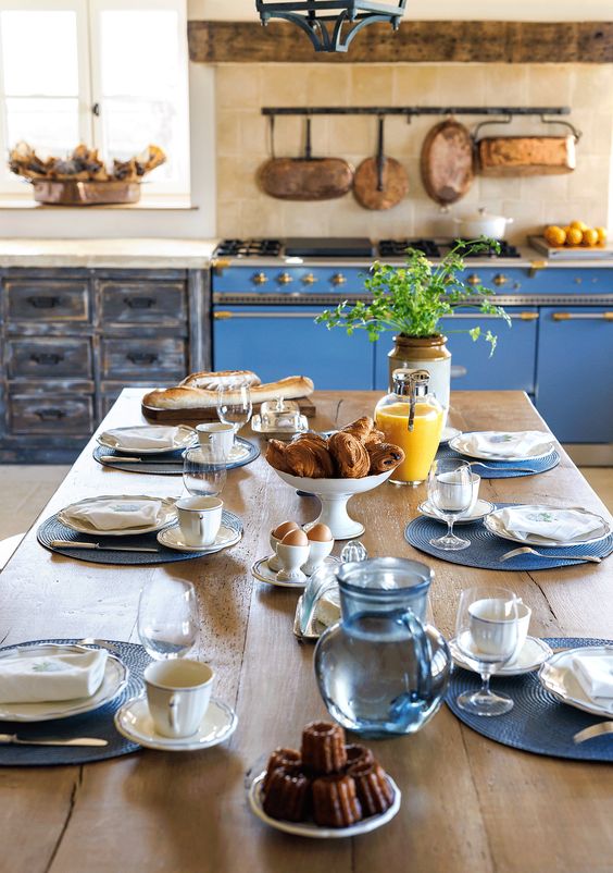maison dubreuil country kitchen with a blue range. 