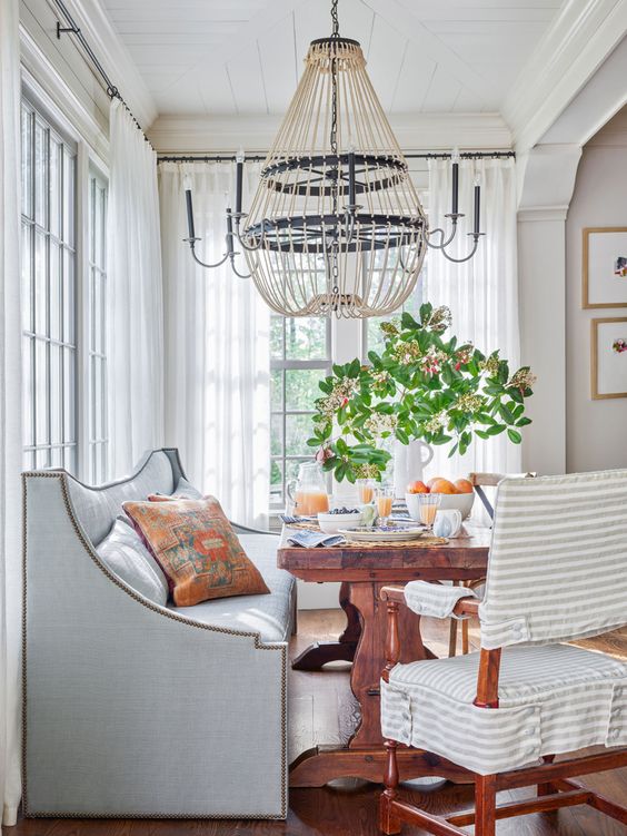 Ashley Gilbreath, dining room with built in banquette in light blue.