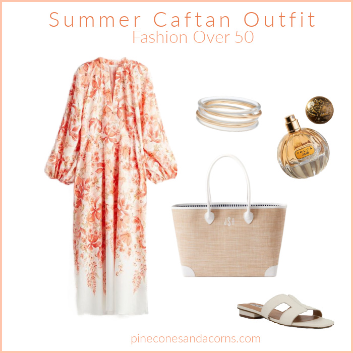 Fashion Over 50 Caftan Outfit with an orange and white caftan, white sandals, white leather trimmed richer bag, stack of gold and silver bangles and a bottle or perfume. 