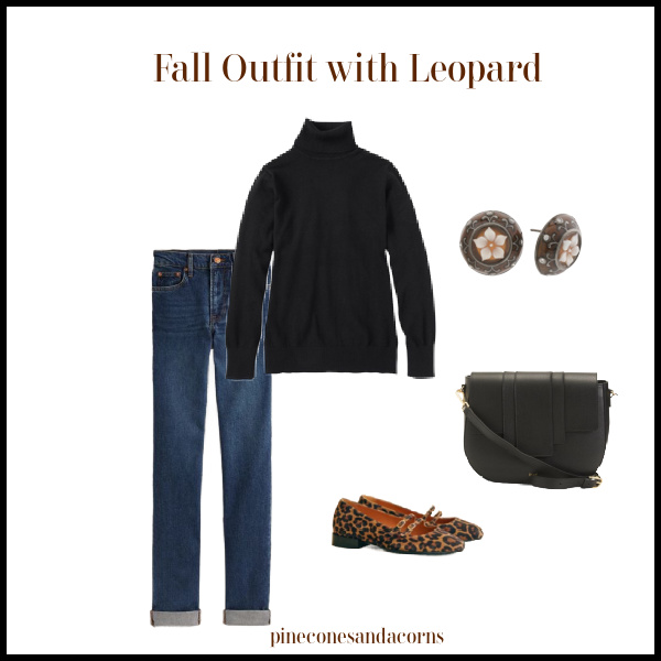 Fall outfit leopard print shoes, jeans, black bag, turtleneck and round brown pattern earrings.