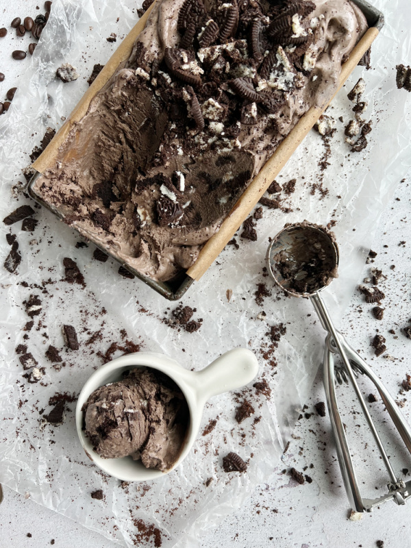 pan of mocha ice cream with an ice cream scoop.