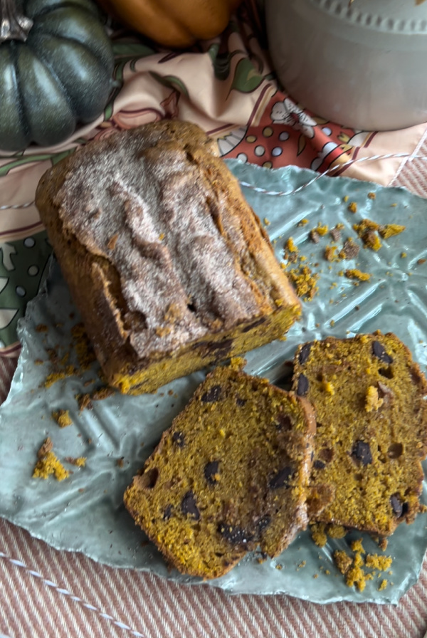 Autumn Loaf Cake sliced on a green plate.