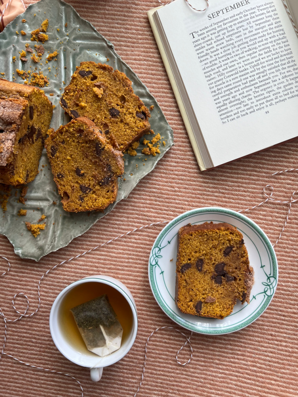 Autumn Spice Loaf with a cup of tea and a book. 