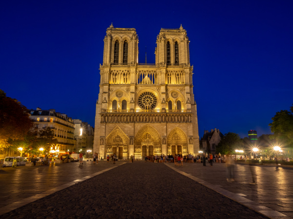 Notre Dame Cathedral at night lit up. 