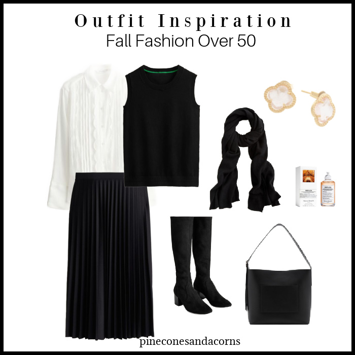 fall fashion women over 50 outfit inspiration tone on ton black with pleated shirt, sweater vest, boots, bag and scarf and gold earrings and perfume.
