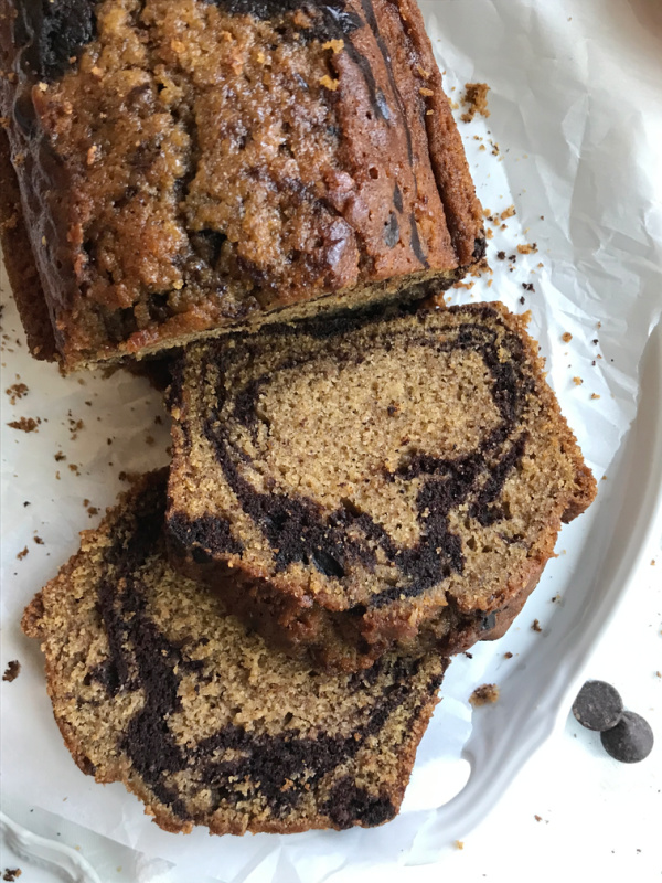 Two sliced of pumpkin marble bread..