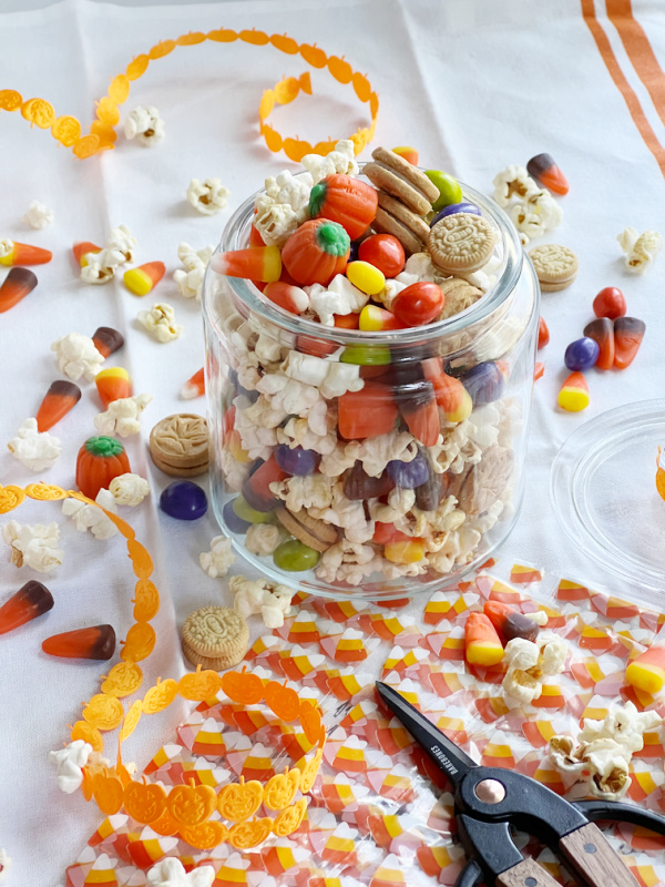 snack mix in a jar with cello bags and scissors