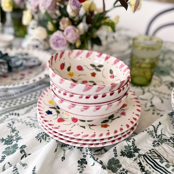 Pile of handpainted dishes. 