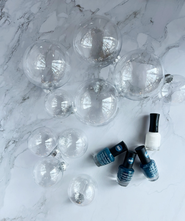 Clear ball ornaments and blue and white nail polish