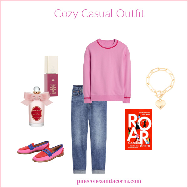 Cozy February Outfit Fashion Over 50 with a pink sweatshirt and jeans.