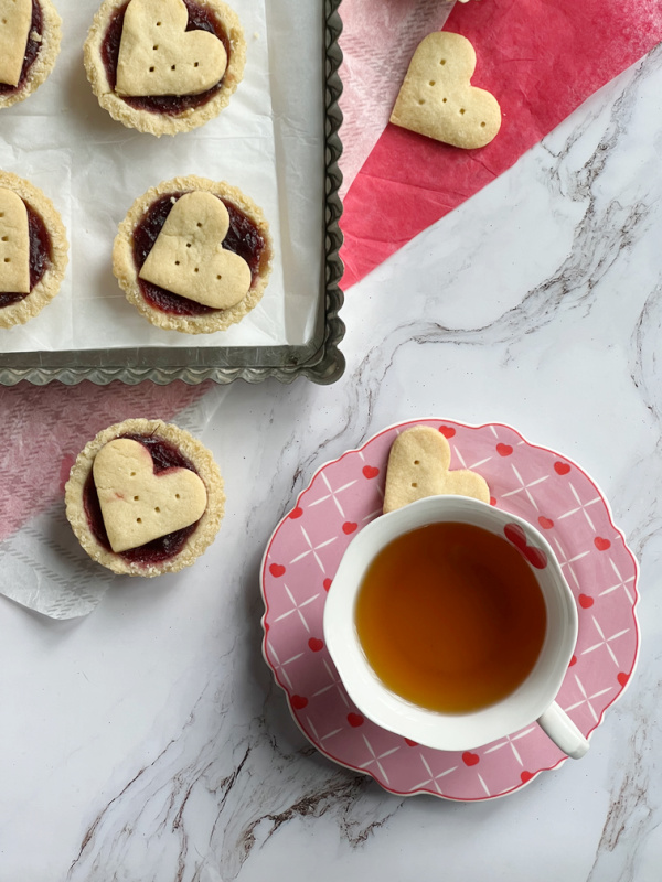 Raspberry almond tart with a cup of tea.