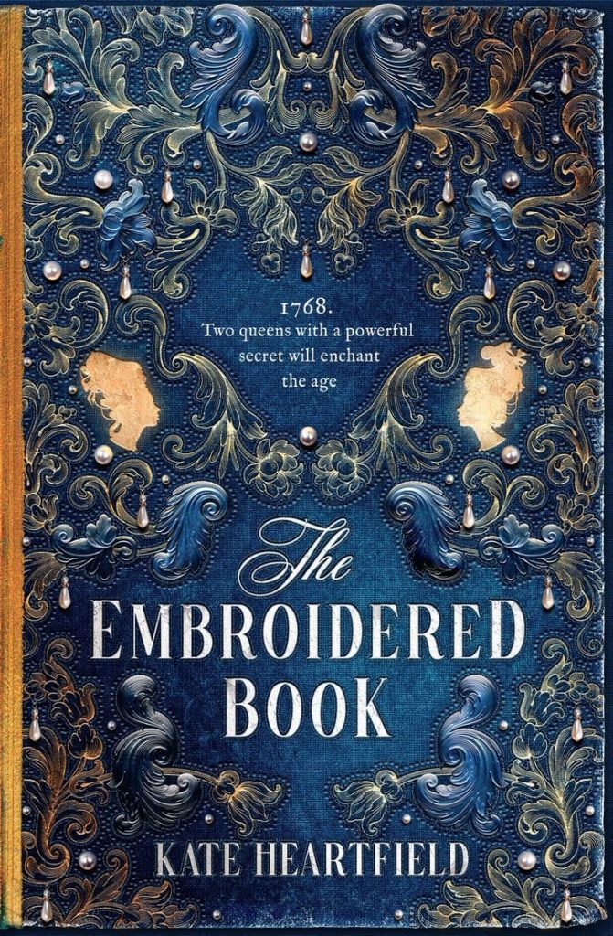 The Embroidered Book cover blue with 2 silhouettes of women. 