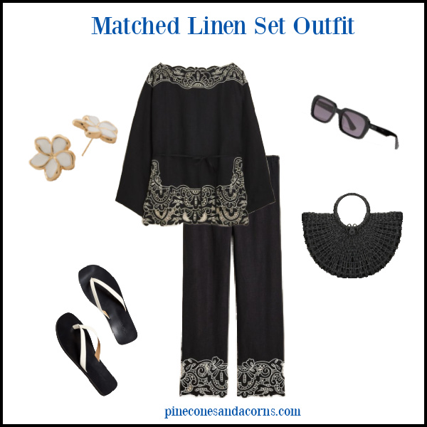 Fashion Over 50 Black and White Linen Outfit with black sun glasses, white thong sandals, white flower earrings, and a black wicker tote.