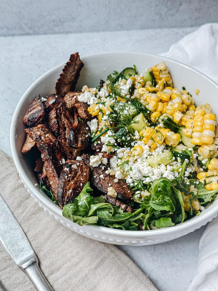 Steak, corn, feta cheese salad.
