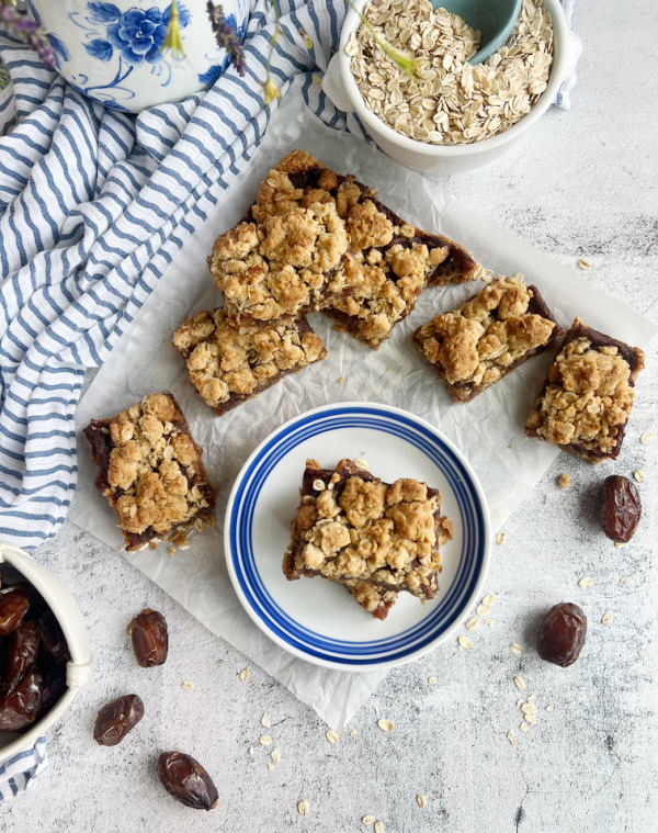 old fashioned date bars sliced and on a blue and white plate.