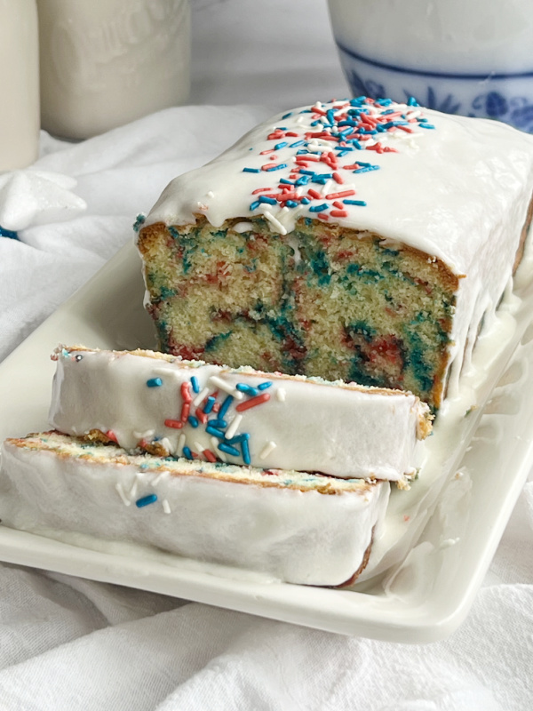 4th July Funfetti pound cake sliced on a white platter. 