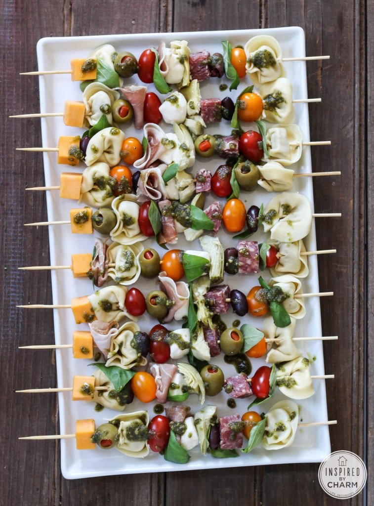 Antipasto skewers on a white platter. 