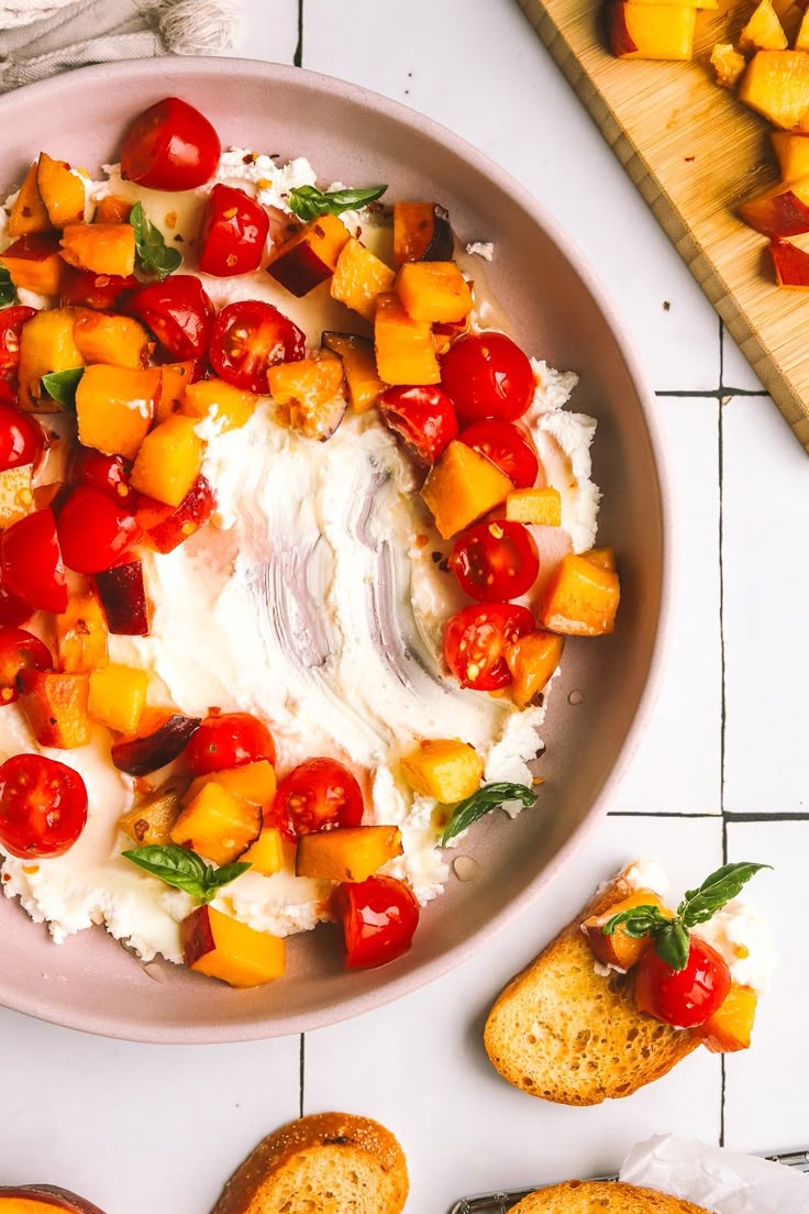 Think crunchy crostini topped with juicy peaches and tomatoes along with the creamiest goat cheese.Fresh, sweet peaches and ripe, juicy tomatoes.