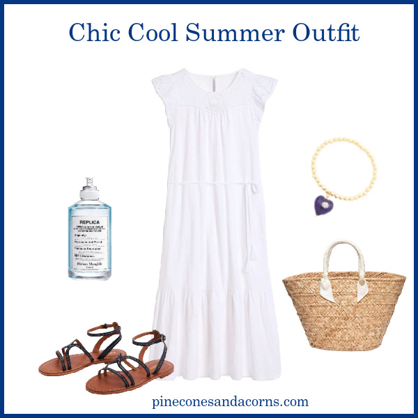 Chic Cool Summer white Outfit with a wicker tote, blue sandals, perfume and a bracelet with a blue charm. 
