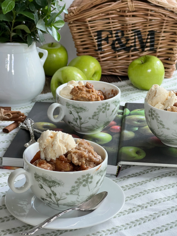 Ina Garten Apple Crisp in 3 cups with apples and an F&M basket.