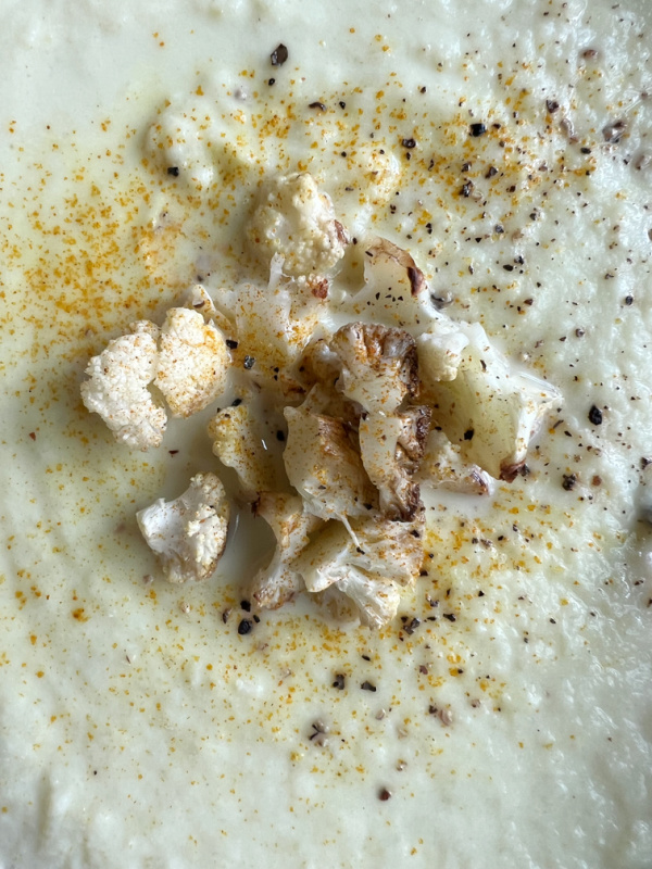 French cauliflower soup with cauliflower florets.