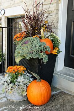 fall urns on front porch. 