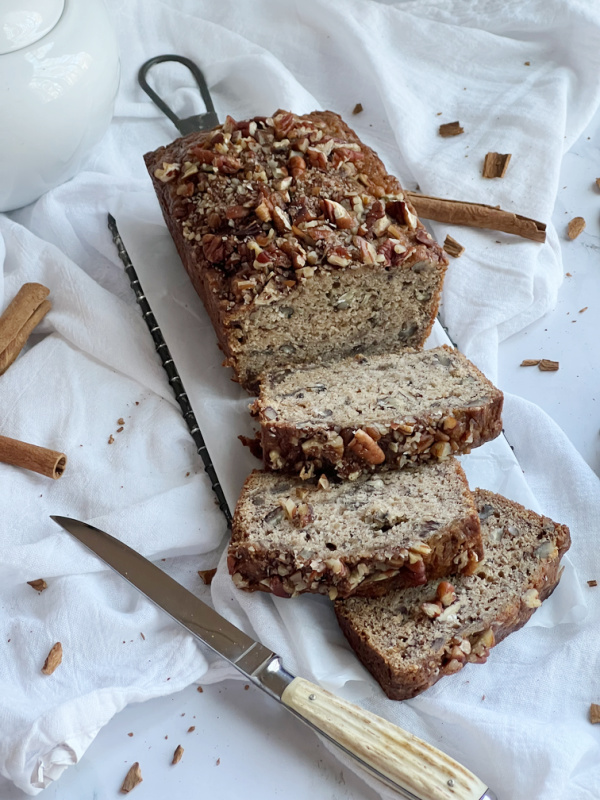 spiced banana bread sliced with a horn handled knife.